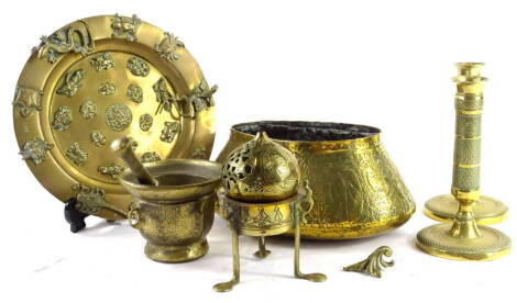 Miscellaneous metalware, to include a Continental brass circular plate, mounted in the Palissy style with insects, animals etc., 25cm dia., Eastern brass dishes, pestle and mortar and a pair of brass candlesticks.