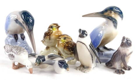 A collection of Danish and other porcelain animals, to include two Bing & Grondahl kingfishers, a pair of Copenhagen small ducks, pair of Danish penguins, Goebel birds etc.