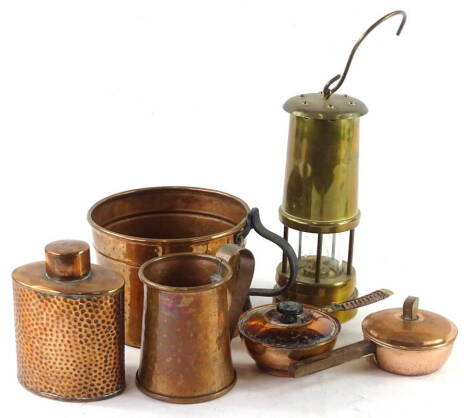 Miscellaneous metalware, to include a brass miners lamp, Arts and Crafts style hammered copper tea caddy, etc.