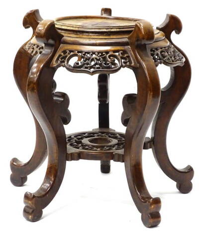 A 19thC hardwood jardiniere stand, with circular top on serpentine legs, with scroll feet, 57cm H, 47cm W, 42cm D.