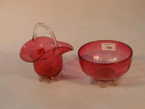 A cranberry glass circular sugar bowl