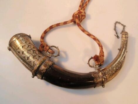 An Eastern powder horn with brass mounts