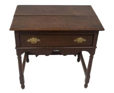 An early 18thC oak side table, with plain top, frieze drawer with brass engraved back plate loop handles, shaped apron, taper turned legs with moulded stretchers, 72cm H, 72cm W, 46cm D. - 2