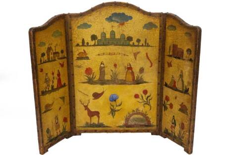 A late 19thC studded leather screen, of triptych form, with arch top and painted with a castle, various buildings, figures and animals, 84cm H, 112cm W.