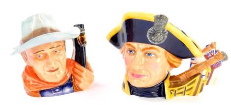 A Royal Doulton character jug modelled as Lord Horatio Nelson, Character Jug of the Year 2005 D7236, together with a character jug modelled as John Wayne, Character Jug of the Year 2007, D7269, both boxed. (2)