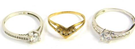 Three 9ct gold and zircon set rings, size O,Q and T, 5.8g.