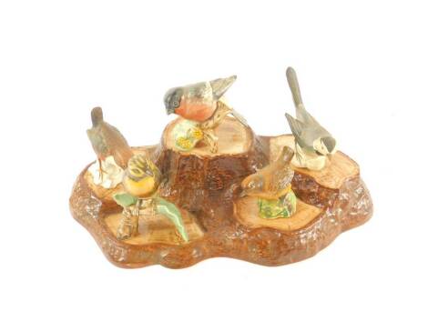 A Beswick pottery tree trunk stand, together with two Beswick birds and three Goebel birds. (6)