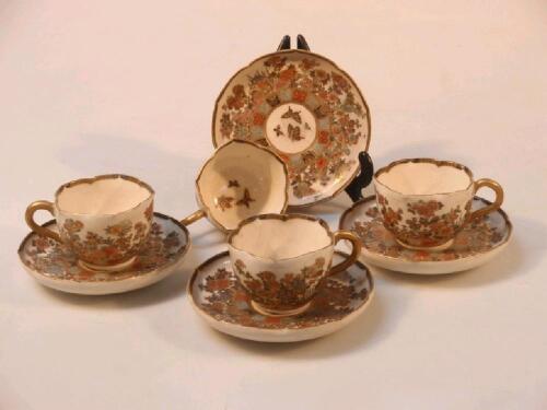 A set of four Satsuma coffee cups and saucers