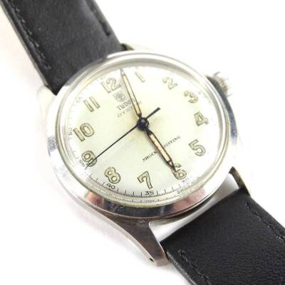 A Tudor Oyster gent's wristwatch, with silvered circular dial, with yellow/cream colours numbers and hands, in stainless steel case numbered 408283, on a later black leather strap, 38.8g all in.
