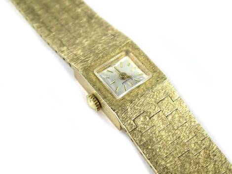 A 9ct gold Accurist ladies wristwatch, with articulated design bracelet, of five row square design, with brushed finish, 18cm long overall, 35.7g all in.