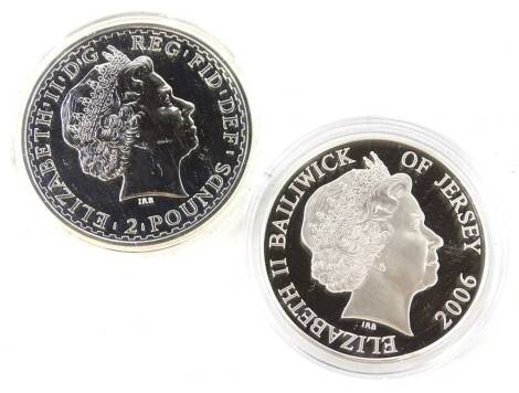 Two silver commemorative coins, a 2007 one ounce of fine silver Britannica and a Bailwick of Jersey 2006 £5 silver proof.