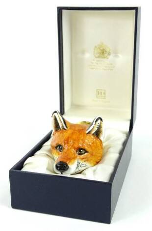 A Halcyon Days enamel box, the fox head stirrup cup inspired by a Derby porcelain original from the 1820's, sold with original receipt, 1999, boxed.