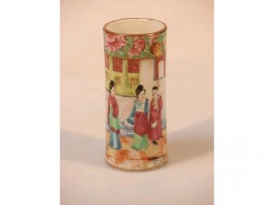 A Chinese famille rose cylinder vase painted with a scene of figures on a terrace