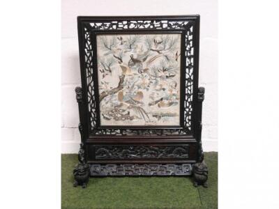 A Chinese carved rosewood screen