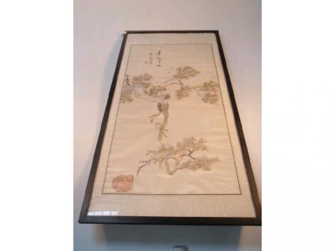 An oriental silk needlework panel depicting a monkey climbing a tree and