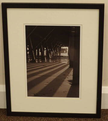 •Peter Farrington (20thC). Under the Pier - Lowestoft, monochrome print, 35cm x 25.5cm. - 2