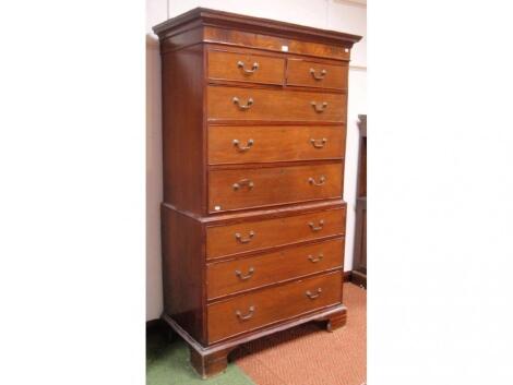 A George III mahogany chest-on-chest with dentil moulded cornice