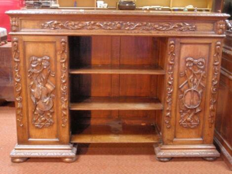 A late Victorian carved oak side cabinet