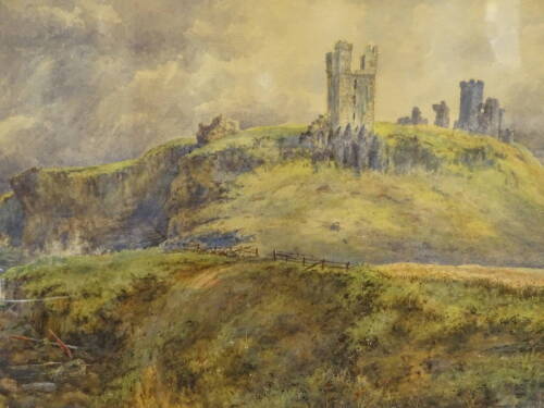 A Woods (19thC). Dunstanburgh Castle, Northumberland, watercolour signed and dated (18)83.