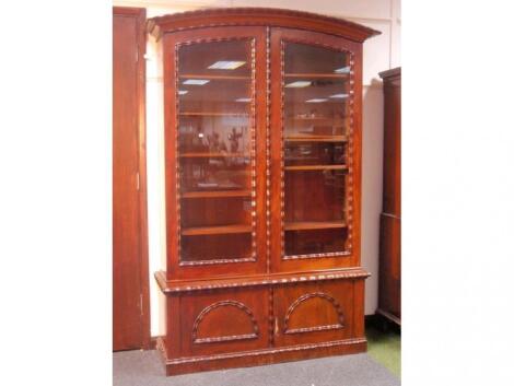 A Victorian figured mahogany stepped bookcase