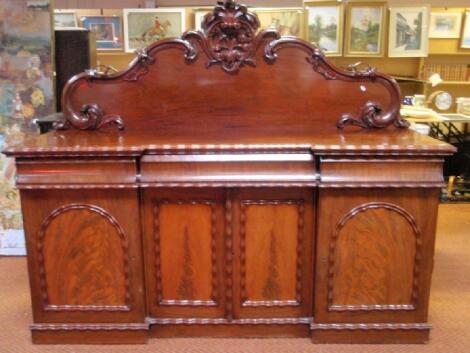 A Victorian figured mahogany sideboard