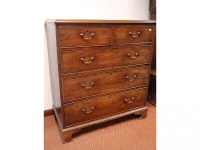 A George III mahogany chest of two short and three long graduated drawers - 2