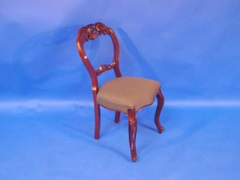A set of six mahogany Victorian style balloon back dining chairs