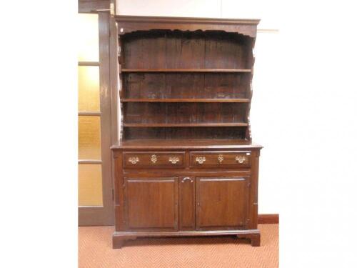 A small oak dresser in the Georgian manner