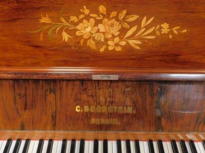 A late 19thC C Bechstein of Berlin rosewood and marquetry cased upright piano, stamped STORRY SOUTHSEA 4944, lower case number 8204 with iron frame No 29124, 127cm H, 146cm W, 59cm D. - 2