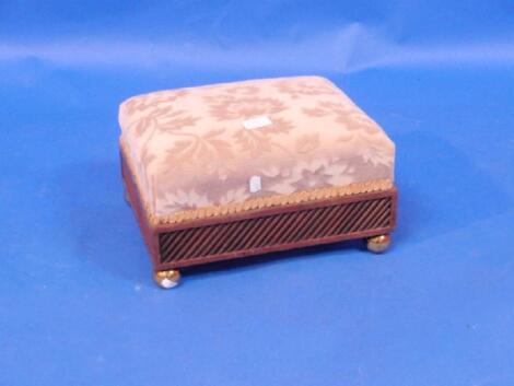 A Regency mahogany footstool with reeded plinth