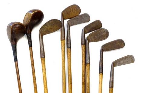 An associated set of hickory shafted golf clubs, to include two drivers, wedges, various makers and owners stamps to include Fred Smythe Royal Dublin, F.W Hall etc. Provenance: Formally the property of Sam King (1911-2003) member of the British team to p