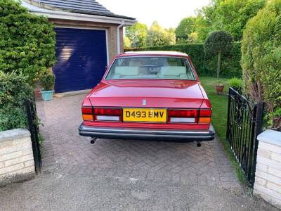 A 1986 Rolls Royce Silver Spirit, D493 BMV, twin carb, five door saloon, 6750cc, in vermilion red, circa 93,389 recorded miles, V5 manual and part service history, originally retailed by Jack Barclay, with running board plaques,  MOT'd until 28/02/2020. - 2