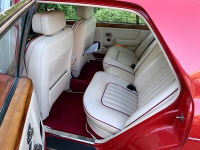 A 1986 Rolls Royce Silver Spirit, D493 BMV, twin carb, five door saloon, 6750cc, in vermilion red, circa 93,389 recorded miles, V5 manual and part service history, originally retailed by Jack Barclay, with running board plaques,  MOT'd until 28/02/2020. - 3