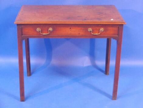 A George III mahogany side table with moulded border and fitted long single