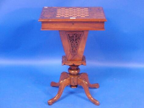 A Victorian figured walnut games/work stand