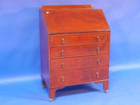 An inlaid mahogany bureau