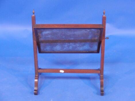 A George III mahogany rectangular toilet mirror on reeded supports