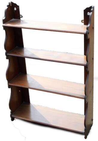 A late 19thC walnut stained wall shelf, with four graduated sections, 89cm H, 61cm W, 24cm D.