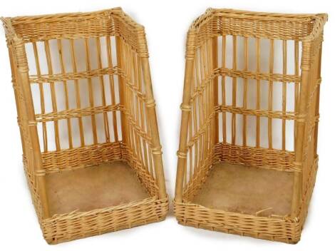 Early 20thC wicker open carrying baskets, each of turned form with wooden bases and open fronts, 68cm H, 47cm W, 36cm D.