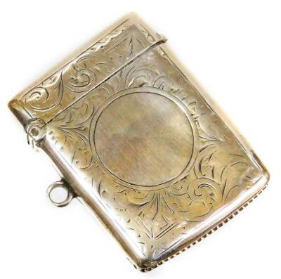 A George V silver vesta case, with engine turned decoration with scrolls and flowers, with vacant cartouche crest, match striker base, Birmingham, 1916. (AF)
