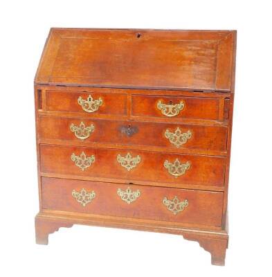 A George III oak bureau, the fall opening to reveal a central drawer flanked by recesses and six drawers, over two short and three long graduated drawers, on bracket feet, 105cm H 95cm W, 52cm D.