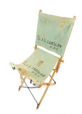 A vintage pre-WWII RAF Officer's canvas beech and iron folding field chair, with carry handle and strap, marked for F/O J. S. CARSLAW RAF Flying Officer J.S. Carslaw of the RAF Medical Branch was promoted to the rank of Flight Lieutenant from the 29th Ma