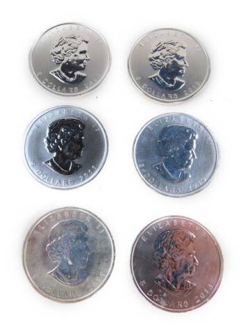 Six Canadian silver Maple Leaf Five dollar coins.