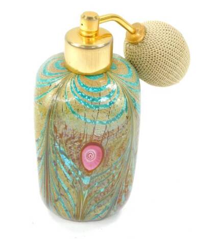 A vintage Murano glass perfume or scent bottle, with gilt metal top and fabric atomiser, the square slab shaped body of a stylised peacock feather design within gold included casement, labelled to base for R Paolotti, Vetri Artist Esclusivi Made in Murano