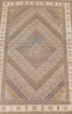 A Ghoochan rug, brown and cream banded, 185cm x 120cm.