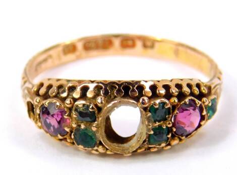 A Victorian 15ct gold and gem set ring, central stone lacking, flanked by amethysts and emeralds, size Q, 2.4g. (AF)