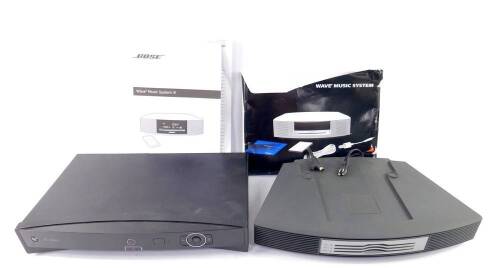 A Bose Wave music system multi-CD changer accessory, N123, together with instructions for a Wave music system, and a BT Vision integrated digital terrestrial receiver and digital video recorder.