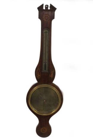 An early 19thC mahogany wheel barometer, with broken arch pediment, floral marquetry roundel over a silvered thermometer, oval shell patera, over 20cm dial, marked Bernasconi & Co, London, over a further floral roundel, 96cm H.