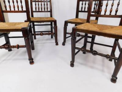 A set of four George III ash spindle back single dining chairs, possibly Lancashire, with rush seats, raised on turned legs, on hoof feet, united by turned stretchers. - 3