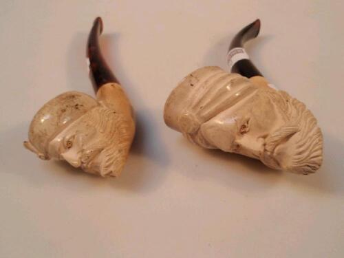 Two carved pipes of turbaned male masks